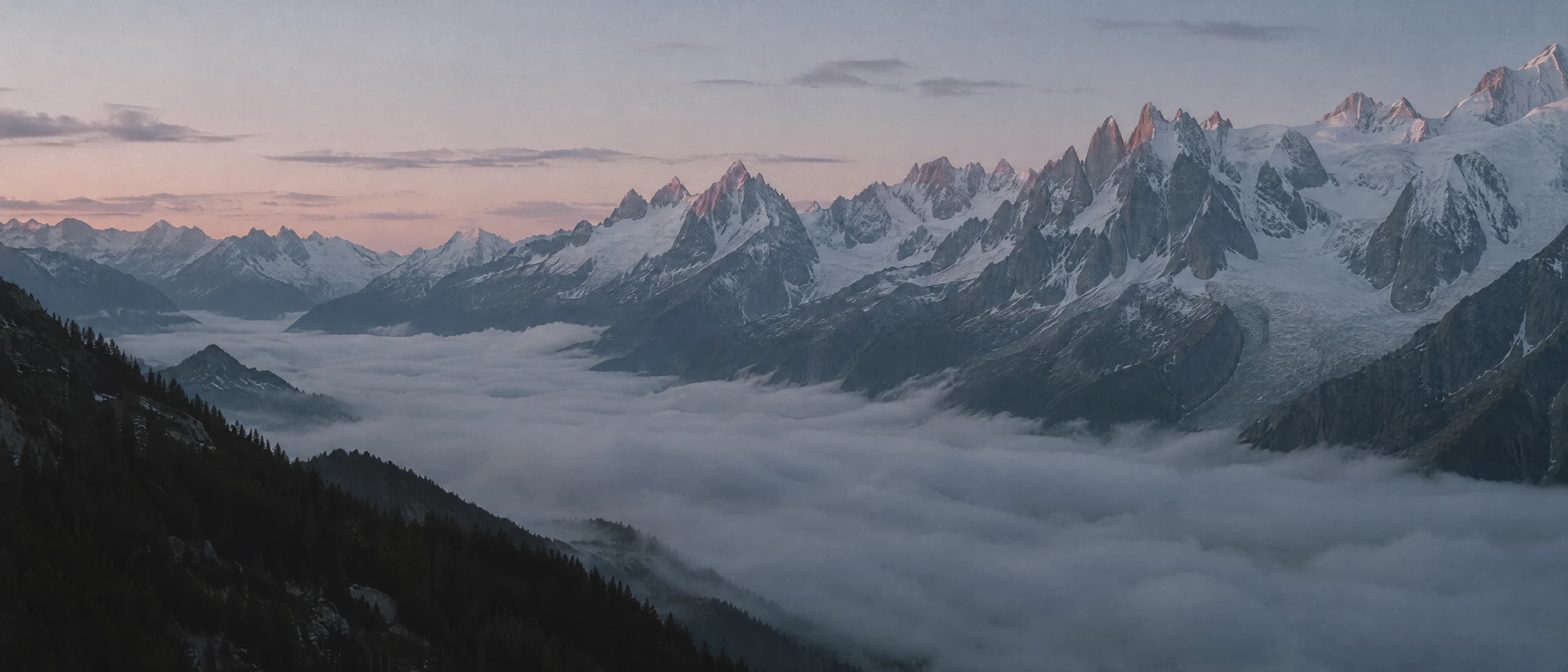 The Chamonix valley at first light, the Aiguilles above the cloud