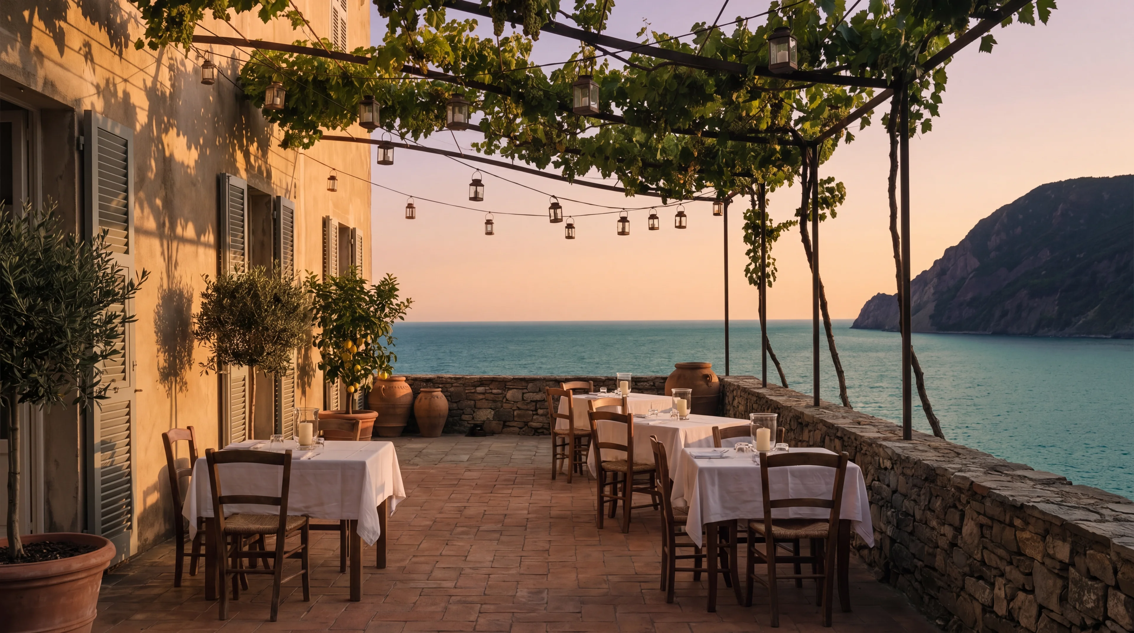 The lower terrace laid for dinner at dusk