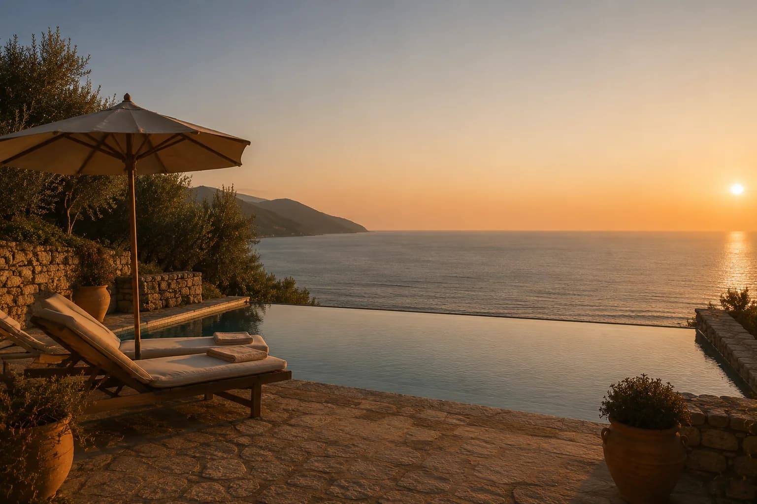 The pool edge meeting the horizon at sunset