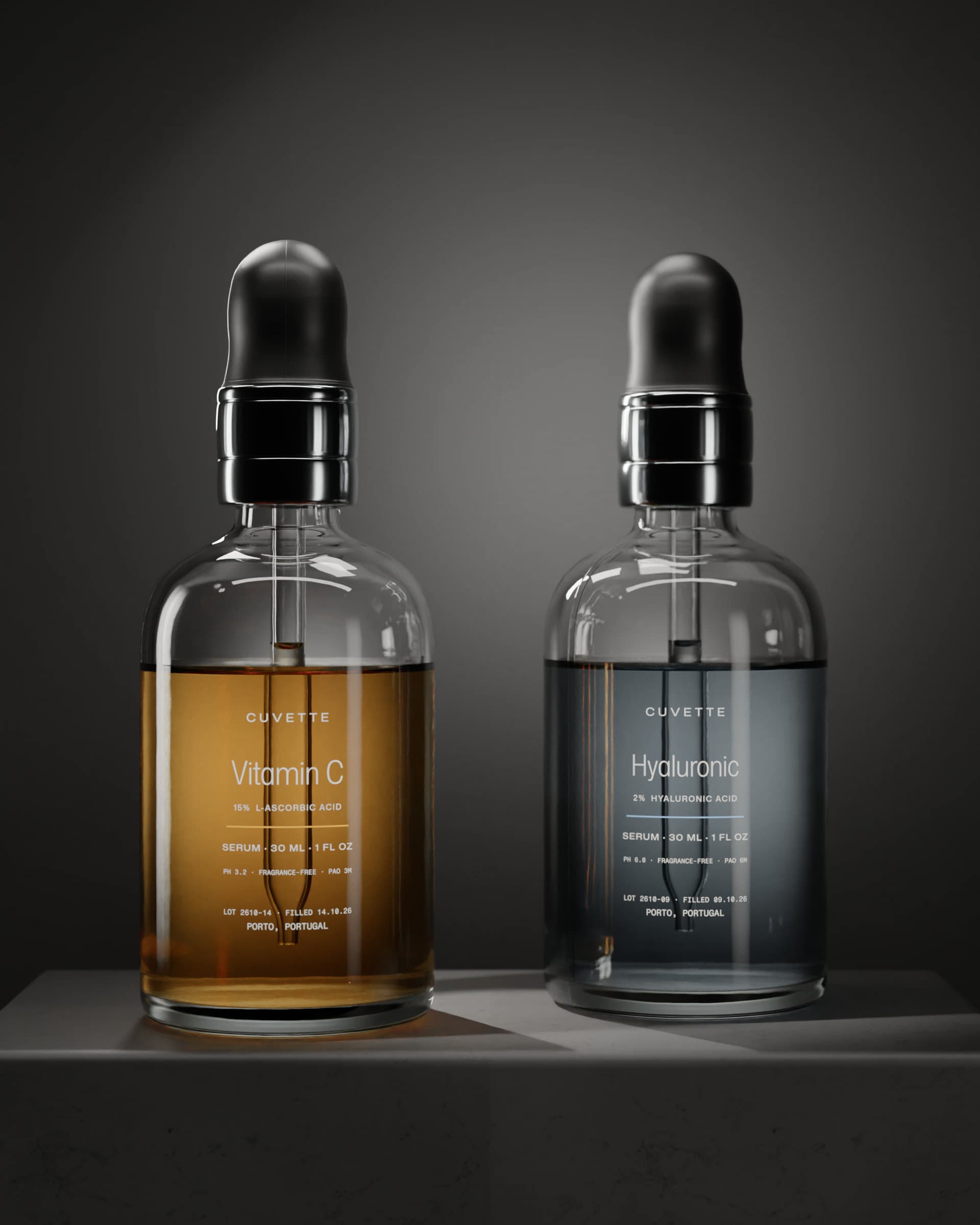 Vitamin C 15% and Hyaluronic 2% bottles on a basalt plinth under a single light
