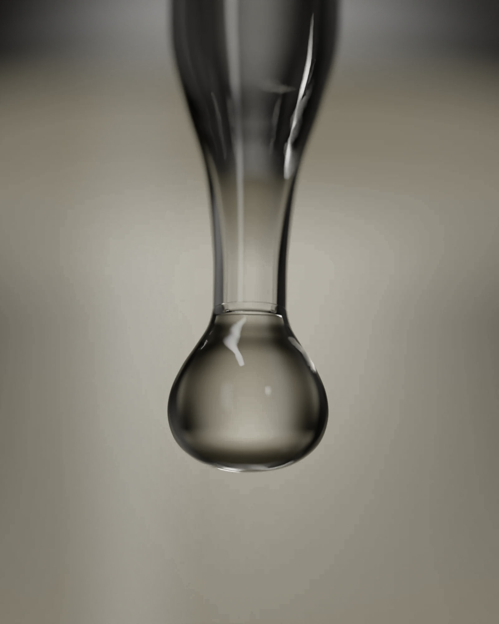 A drop of Niacinamide 10% falling from the dropper