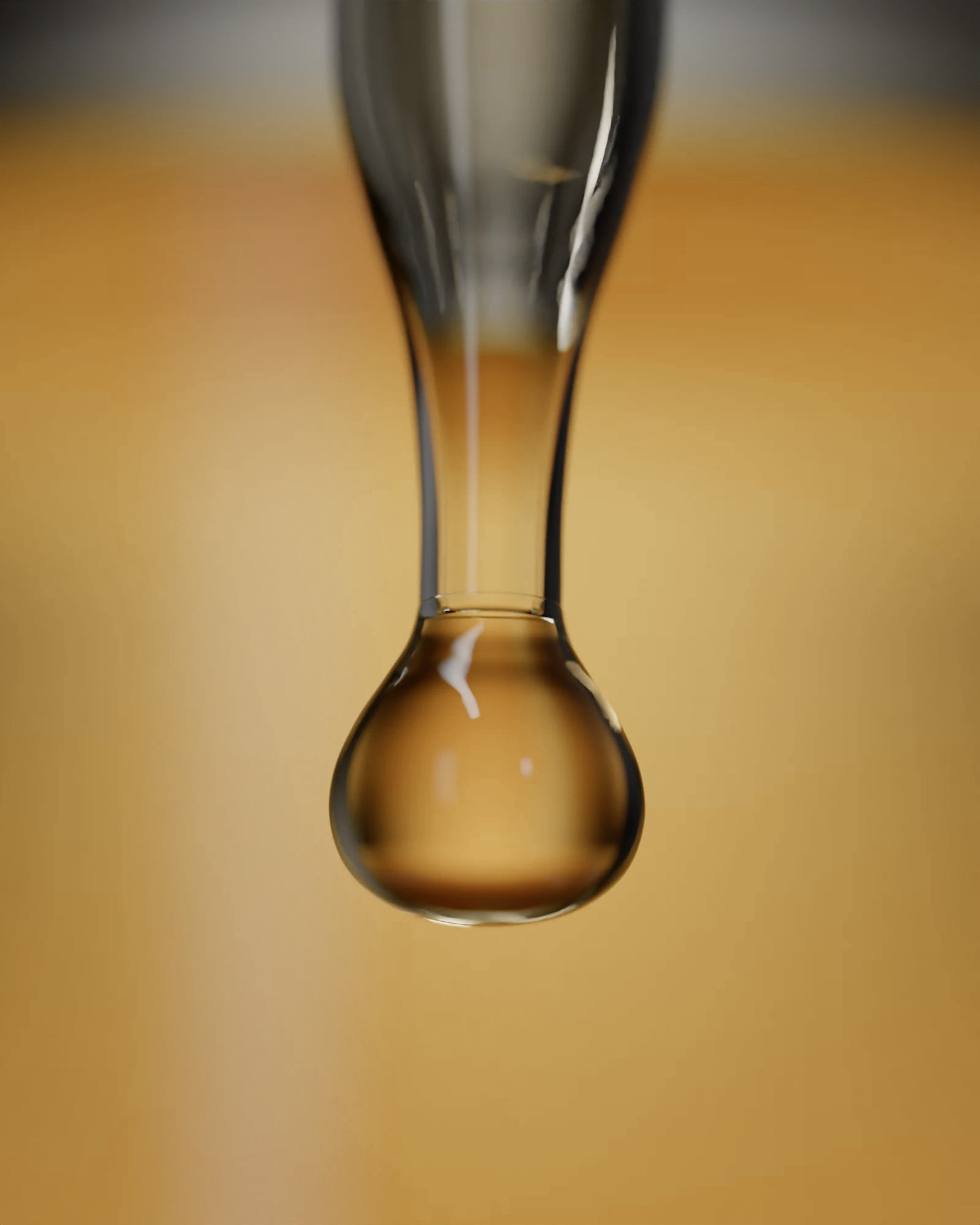 A drop of Vitamin C 15% falling from the dropper